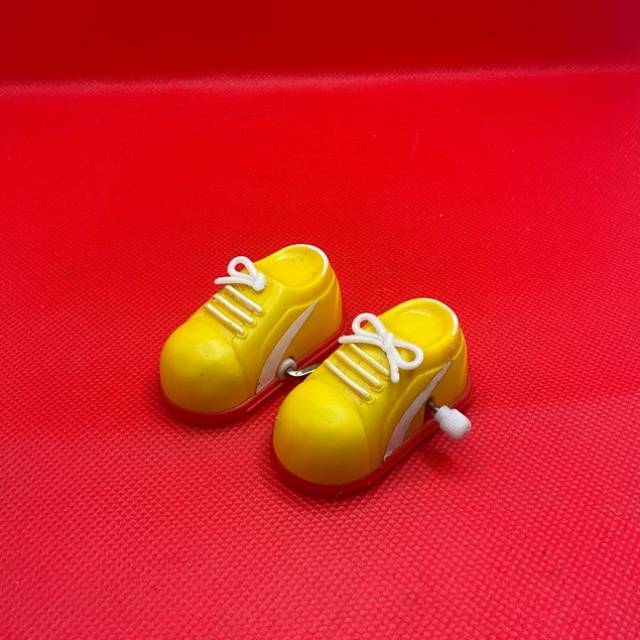 Yellow Pair Of Wind Up Walking Sneakers Toy